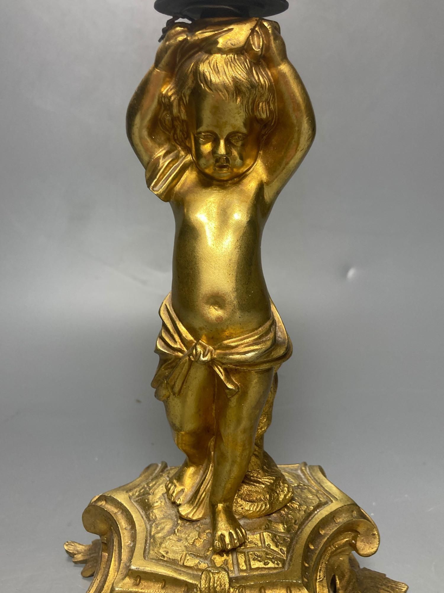 A 19th century ormolu figural lamp stem, 21cm excluding light fitting
